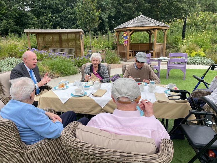 A visit of tea, laughter, and reflection – Local MP visits care home